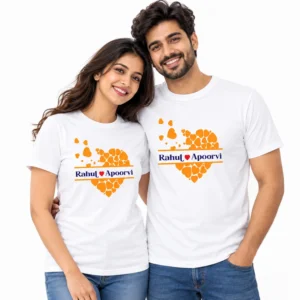 Smiling Indian couple wearing matching white T-shirts with orange heart collage artwork and Rahul and Apoorvi names separated by a red heart.