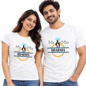 Indian couple wearing matching white Mr & Mrs Sharma T-shirts featuring a blue diamond, black lettering, golden ring, and navy horizontal lines.