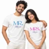Indian couple wearing white Mr. and Mrs. Sharma matching T-shirts with blue MR. lettering, pink MRS. lettering, and Est 2023.