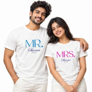 Indian couple wearing white Mr. and Mrs. Sharma matching T-shirts with blue MR. lettering, pink MRS. lettering, and Est 2023.