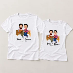 Personalised couple T-shirts in white with matching caricature portrait, custom names and wedding date printed on the front.