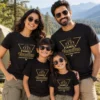 Family of four wearing matching black Family Vacation Making Memories Together T-shirts with mountain and pine tree design