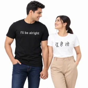 Indian couple wearing coordinated black and white couple T-shirts, with I'll be alright printed in white on the men's black T-shirt and तू है तो printed in black Hindi lettering on the women's white T-shirt.