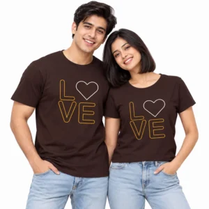 Indian couple wearing matching dark brown T-shirts with gold outlined LOVE lettering and white outlined heart designs.