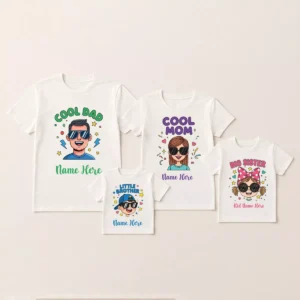 Four white personalised family t-shirts are arranged on a clean, light-colored background. The shirts are for a dad, mom, big sister, and little brother, each featuring a unique cartoon avatar and customizable name placeholder. The shirts are printed with "Cool Dad," "Cool Mom," "Big Sister," and "Little Brother."