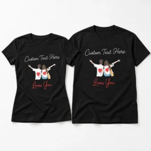 Personalised couple T-shirts in black shown as a matching set of two with custom text, cartoon couple illustration, red heart details, and Loves You lettering.