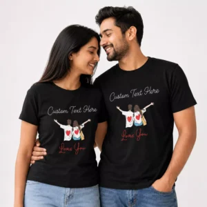 Couple wearing black personalized T-shirts with custom name text, cartoon couple illustration, and romantic โloves youโ design.