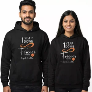 Personalized 1st anniversary couple hoodies with “1 Year Down Forever to Go” design worn by a smiling couple