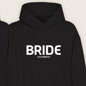 Close-up of black Bride hoodie with bold white text and custom wedding date printed on the front.