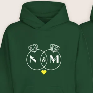 Close-up view of green personalized couple hoodie with custom initials and lotus design