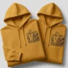 Matching couple hoodies with personalized line-art photo embroidery in mustard yellow