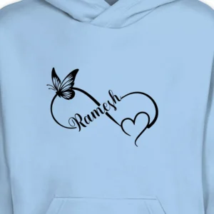 Close-up view of custom name print with butterfly and heart design on light blue couple hoodie