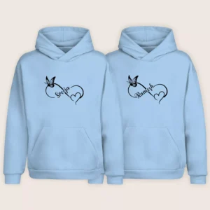 Light blue couple hoodies with custom names printed in a butterfly heart design