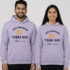 Couple wearing custom 2nd anniversary matching couple hoodies with “Just Married 02 Years Ago” printed and personalized names.