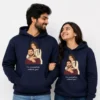 Couple wearing matching navy hoodies with a custom illustrated couple portrait design and “I’m incomplete without you!” text, shown as personalized anniversary gift sweatshirts.