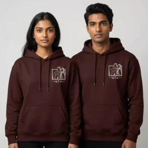 Couple wearing maroon custom embroidered hoodies with white line-art portrait design
