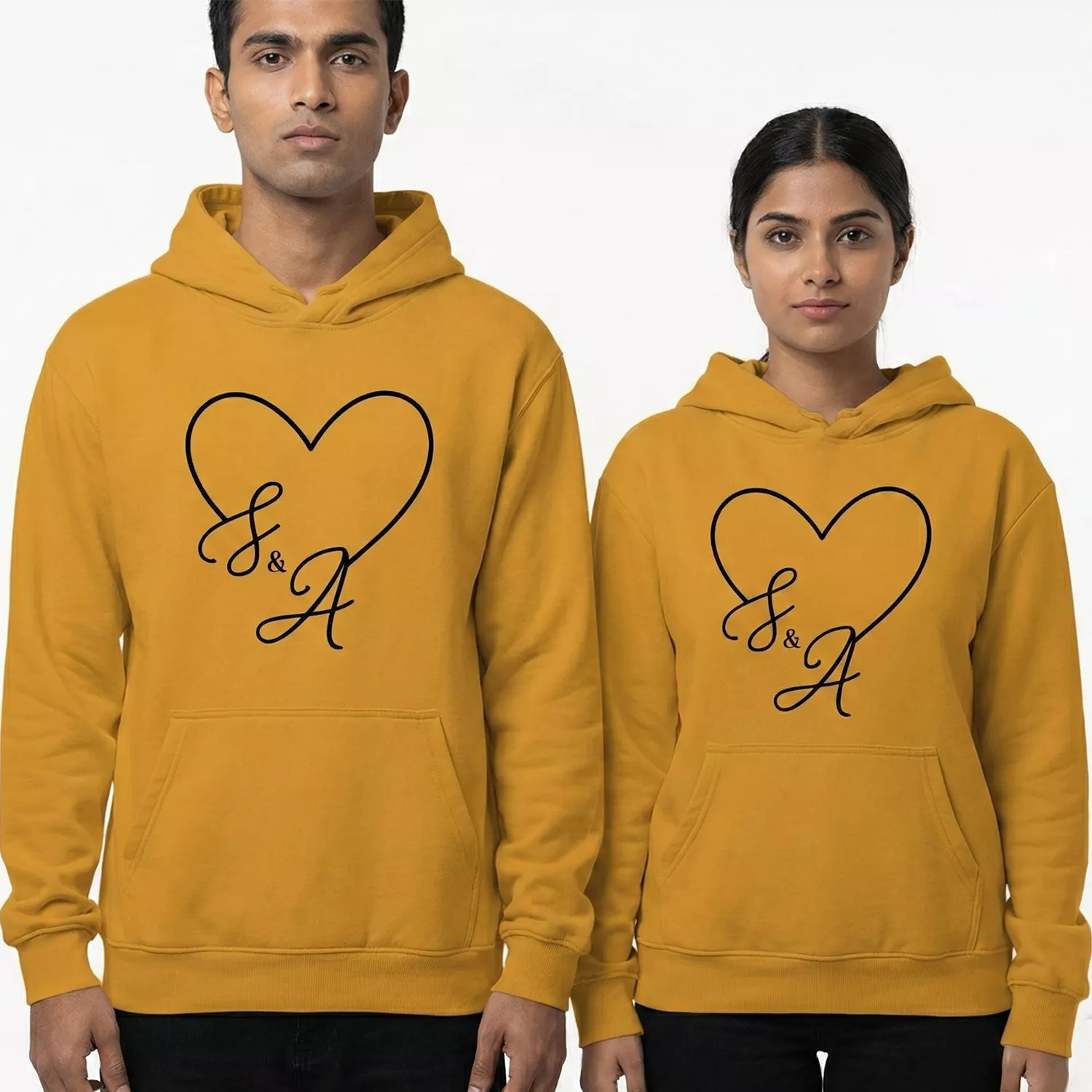 Matching custom initials printed couple hoodies with heart design in mustard yellow color