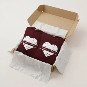 Gift box packaging of maroon custom name couple hoodies with white heart design and personalized names.