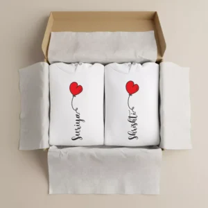 Gift box with two personalized white couple hoodies featuring red heart balloon and custom name print