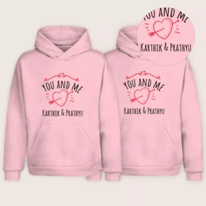 Pink custom name printed couple hoodie pair with heart design and personalized names