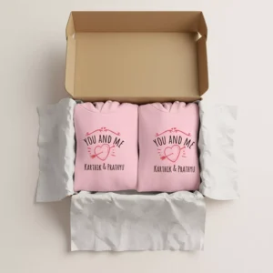 Pink custom name printed couple hoodies neatly packed in a gift box with “You and Me” heart design
