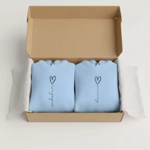 Gift box with two light blue custom printed name couple hoodies featuring heart design – perfect romantic gift for couples
