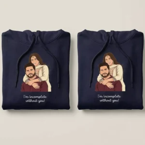Folded personalized anniversary couple hoodies with custom vector cartoon artwork in navy blue