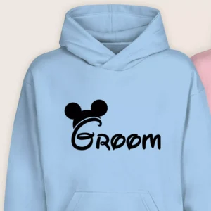 Close-up of blue Groom hoodie with stylish black printed design for couples