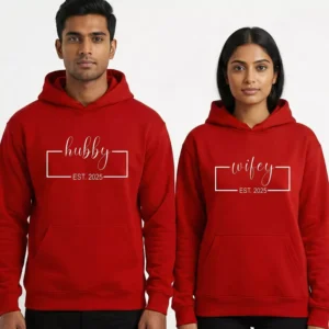 Matching red couple hoodies with Hubby and Wifey EST 2025 print worn by a man and woman
