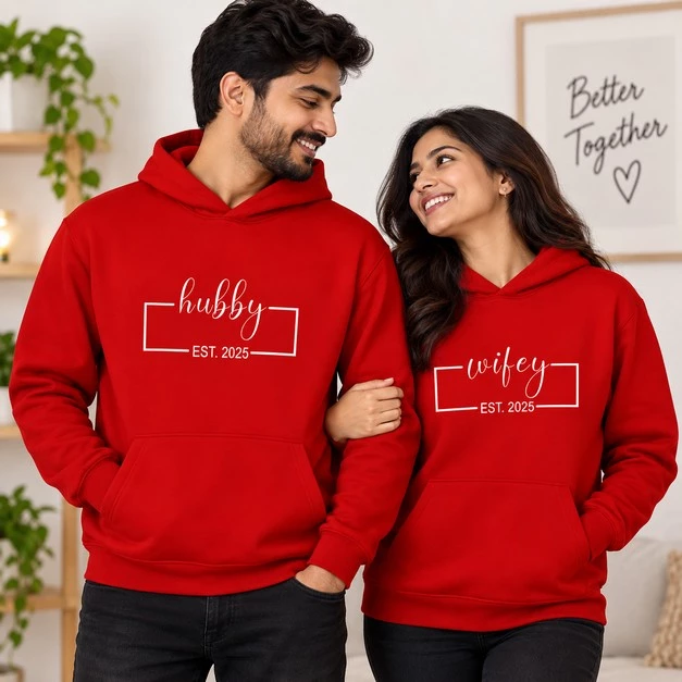 Matching red couple hoodies with Hubby and Wifey EST 2025 print worn by a man and woman