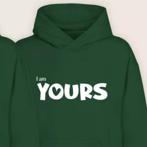 Close-up view of green “I Am Yours” couple hoodie with white printed text