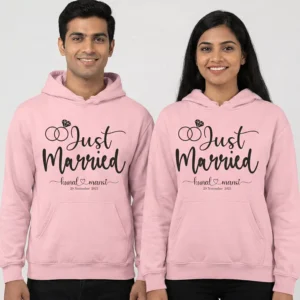 Pink “Just Married” personalized 8th anniversary couple hoodies with custom names and date worn by a smiling man and woman.