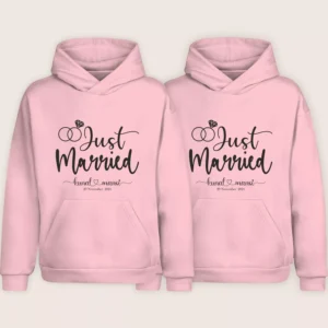 Two pink “Just Married” personalized couple hoodies with custom names and date displayed on a plain background.