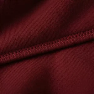 Close-up view of maroon hoodie fabric and stitching used for personalized hoodies