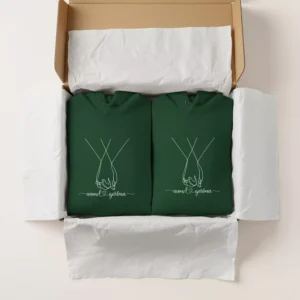 Matching couple hoodies with personalized names packed in a gift box – custom dark green hoodie pair by Printgen