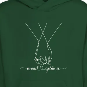 Close-up view of matching couple hoodies with personalized names and hand-holding line art design in white print on dark green fabric