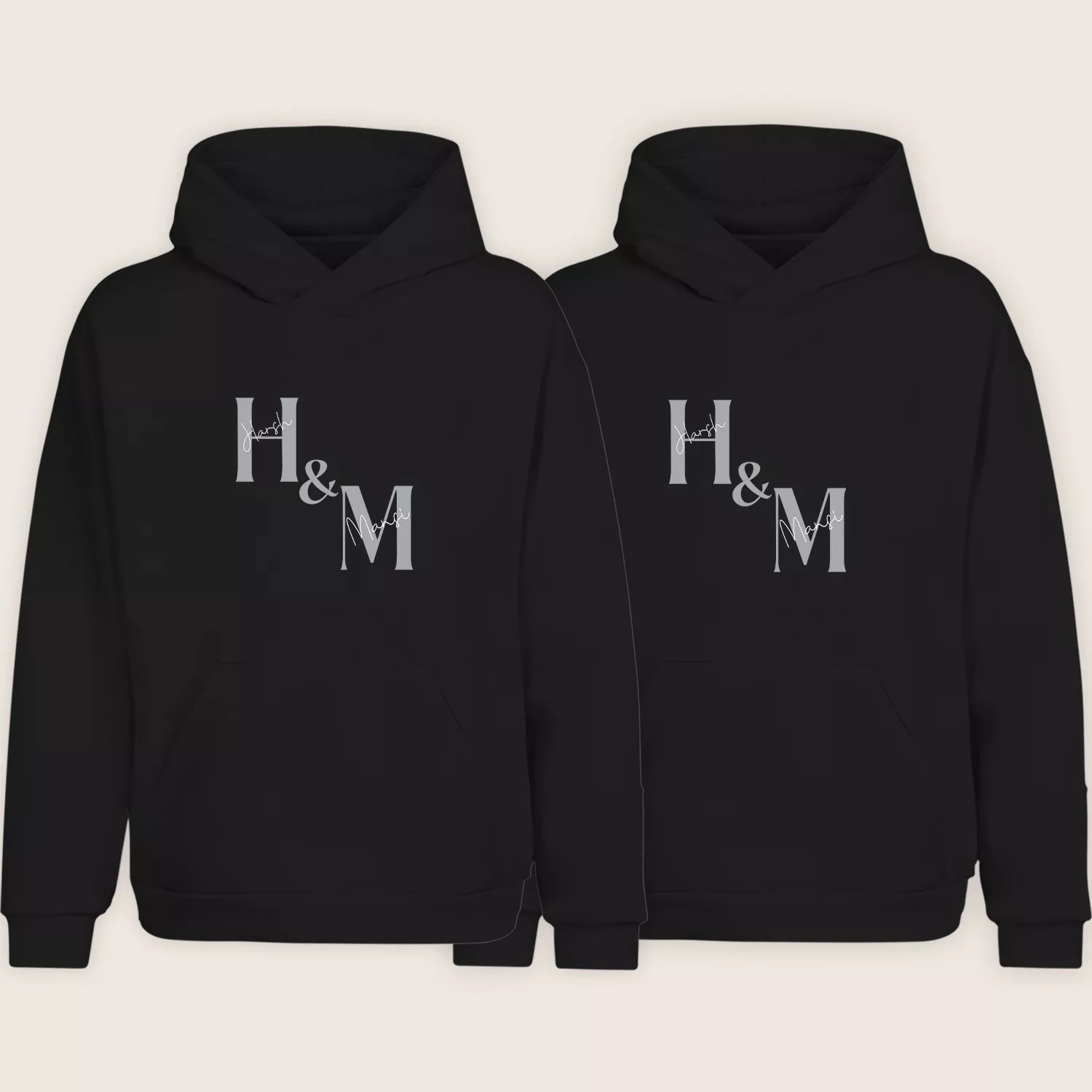 Matching personalized couple hoodies with custom initials H and M printed on black hoodie set