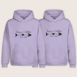 Minimal name printed couple hoodies in lavender color with personalized names and arrow heart design – custom matching hoodies for couples.