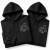 Black personalized couple hoodies with white embroidered line art portrait and R S initials
