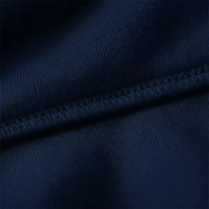 Close-up view of navy blue hoodie fabric and stitching used for personalized hoodies