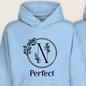 Close-up of light blue personalized hoodie with floral monogram initial N and “Perfect” text.