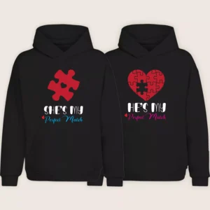 Matching couple hoodies with red puzzle piece and heart puzzle design saying “He’s My Perfect Match” and “She’s My Perfect Match” on black hoodies