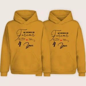 Matching mustard hoodies for couples with personalized 4-year anniversary design and custom names