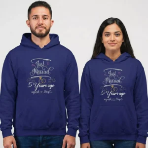 Couple wearing personalized 5th anniversary couple hoodies with “Just Married 5 Years Ago” custom design in navy blue.