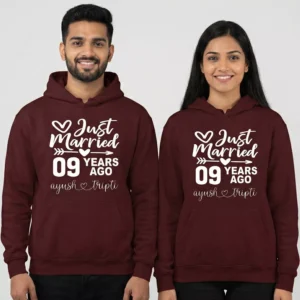 Couple wearing personalized 9th anniversary couple hoodies with “Just Married 09 Years Ago” printed design