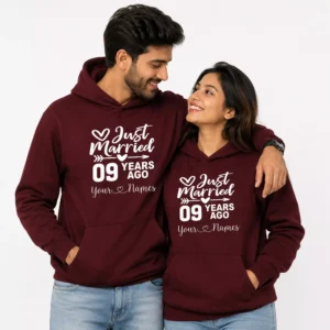 Couple wearing matching burgundy personalized anniversary hoodies with “Just Married 09 Years Ago” design and custom names print.