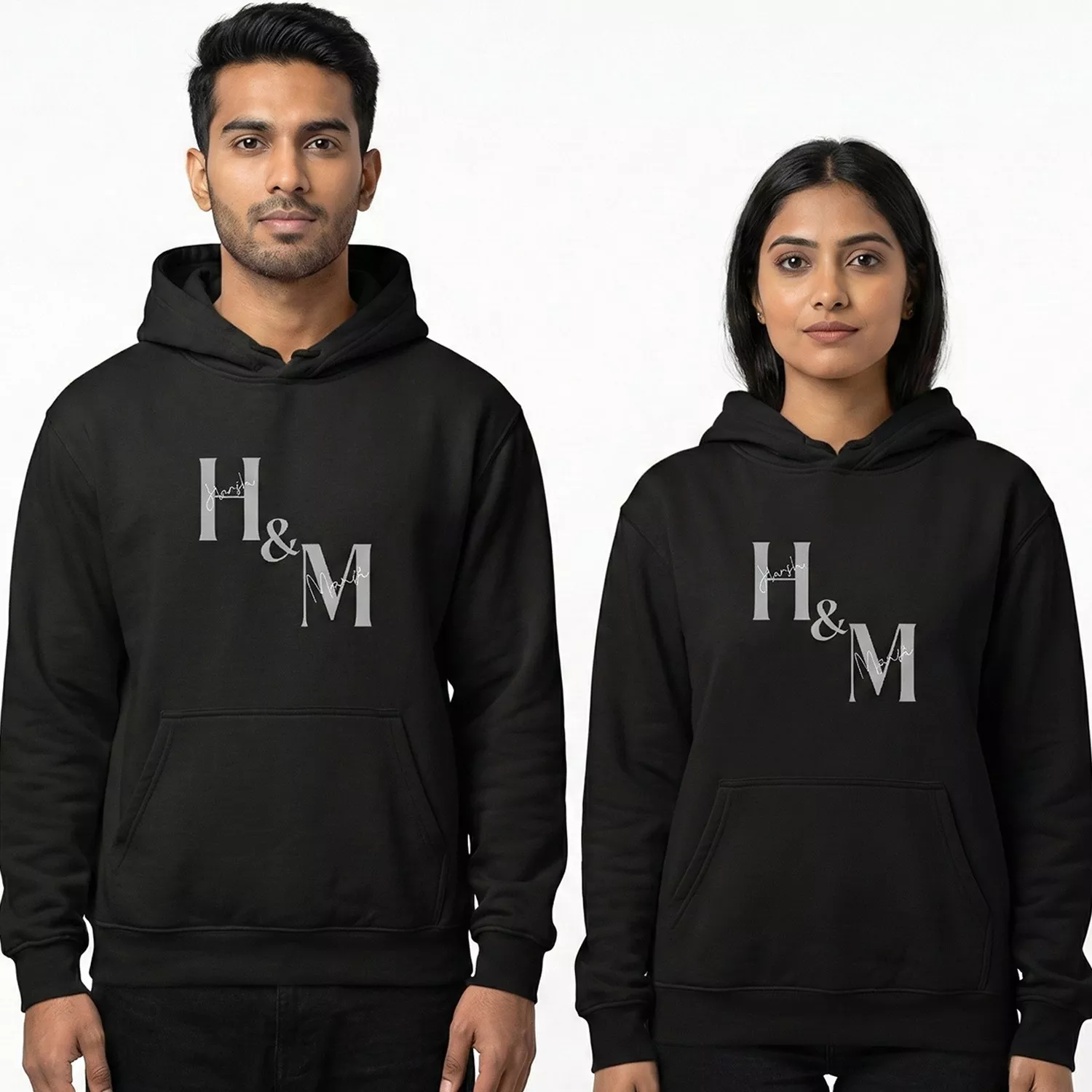 Personalized couple hoodies with custom initials H and M printed on black matching hoodie set