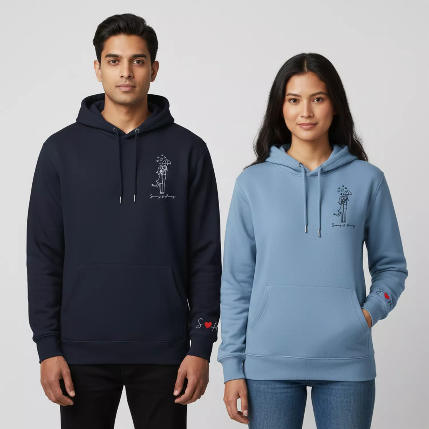Couple wearing personalized hoodies with names and sleeve initials in matching line-art design.