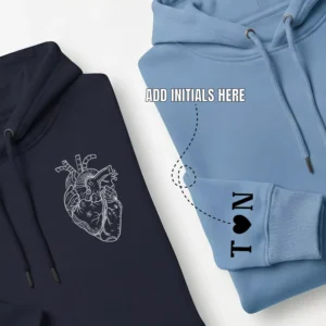 Close-up view of sleeve initials customization on anatomical heart couple hoodies – personalized crown design hoodies