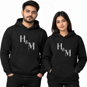 Black personalized couple hoodies with gray H and M initials and subtle cursive accents across the chest design.